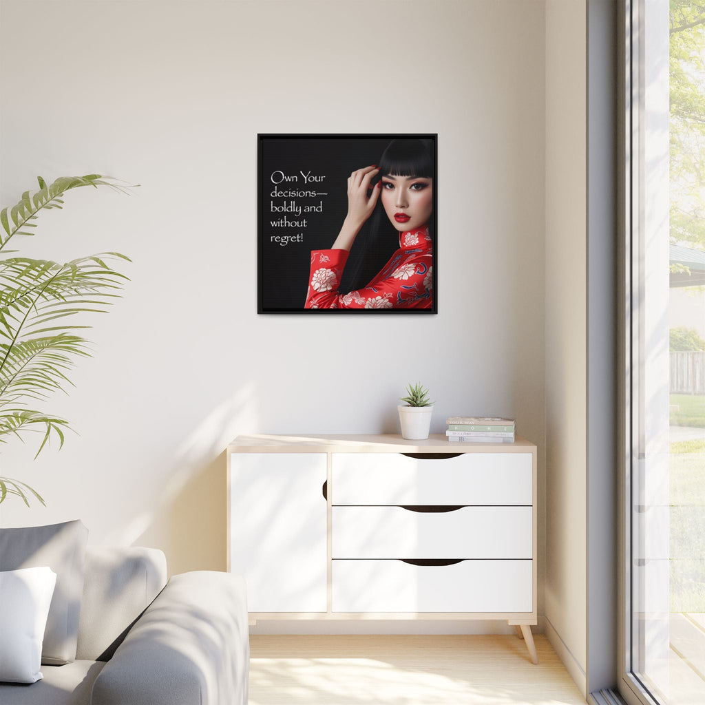 Framed artwork of a Asian woman in a red floral outfit on a wall above a white cabinet.