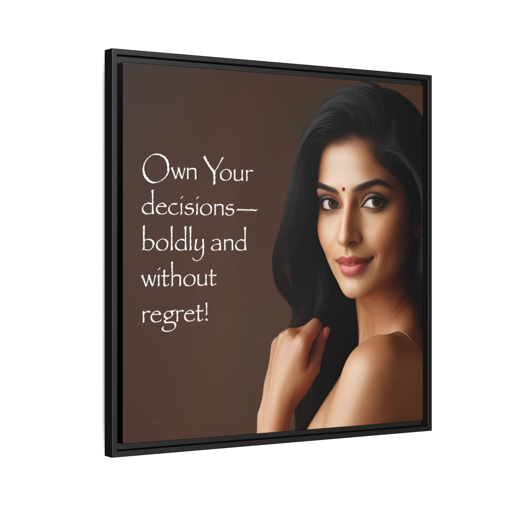 Framed canvas wall decor with a woman with bindi and motivational quote on a brown background.