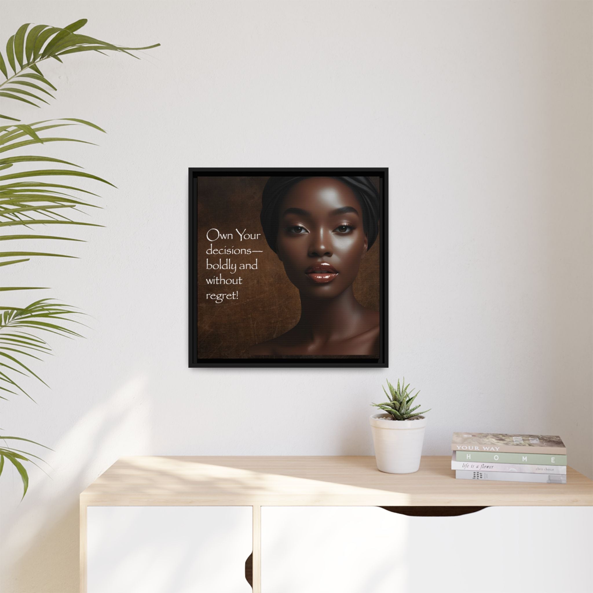 Inspirational artwork of a woman with motivational quote on a wall above a desk with decor items.