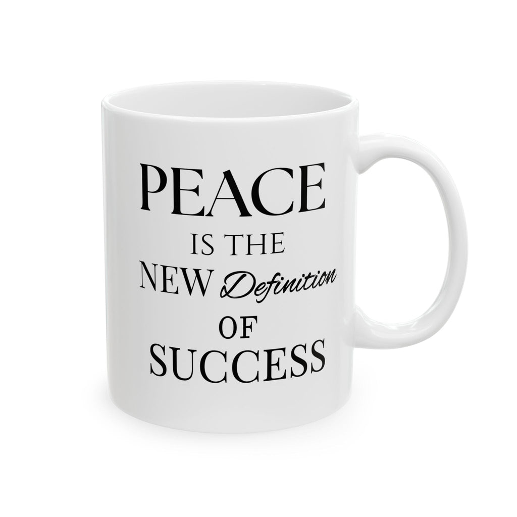 Close-up of “Peace Is the New Definition of Success” text on ceramic coffee mug