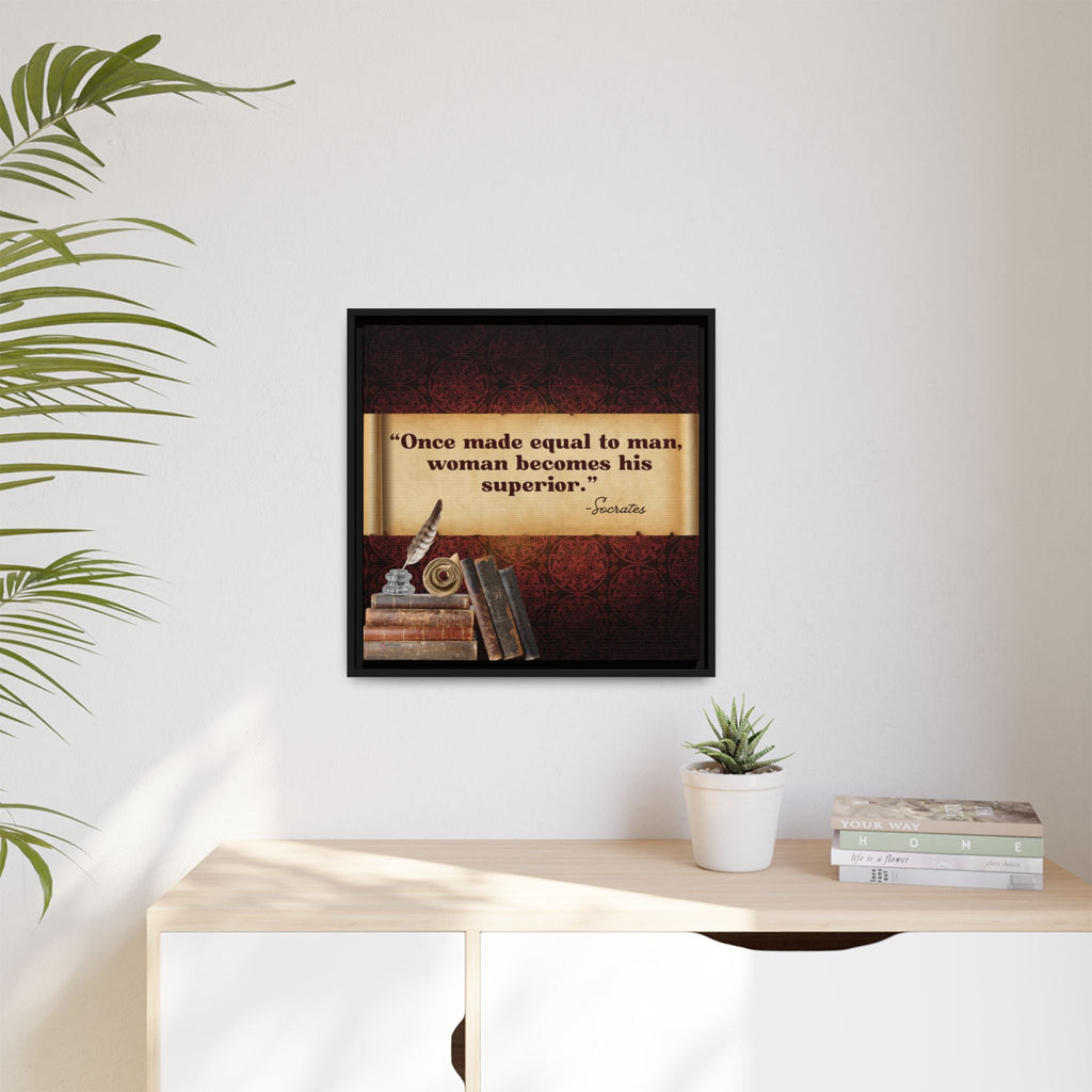 Framed Socrates quote on a wall above a desk with books and a plant.