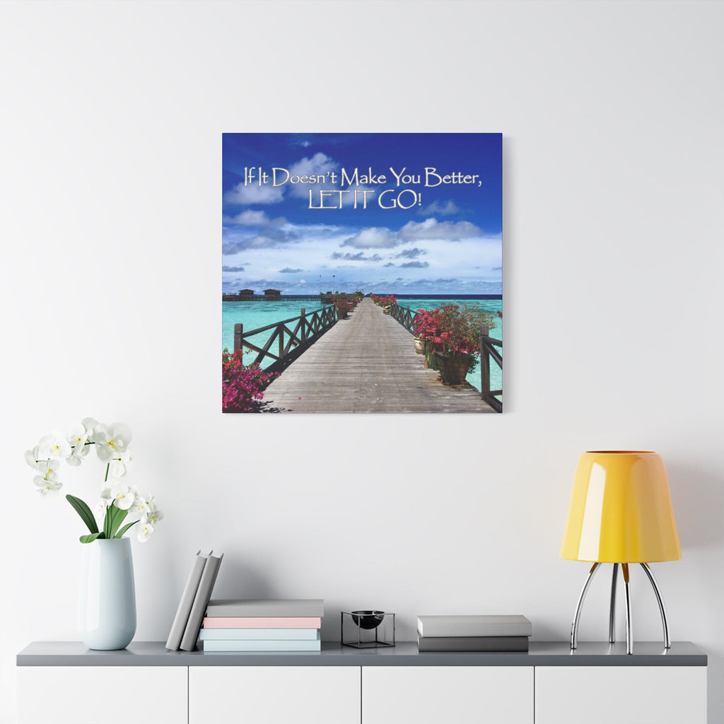Inspirational Wall Art of Beach Serenity Print on a wall above a white cabinet with a plant and books.