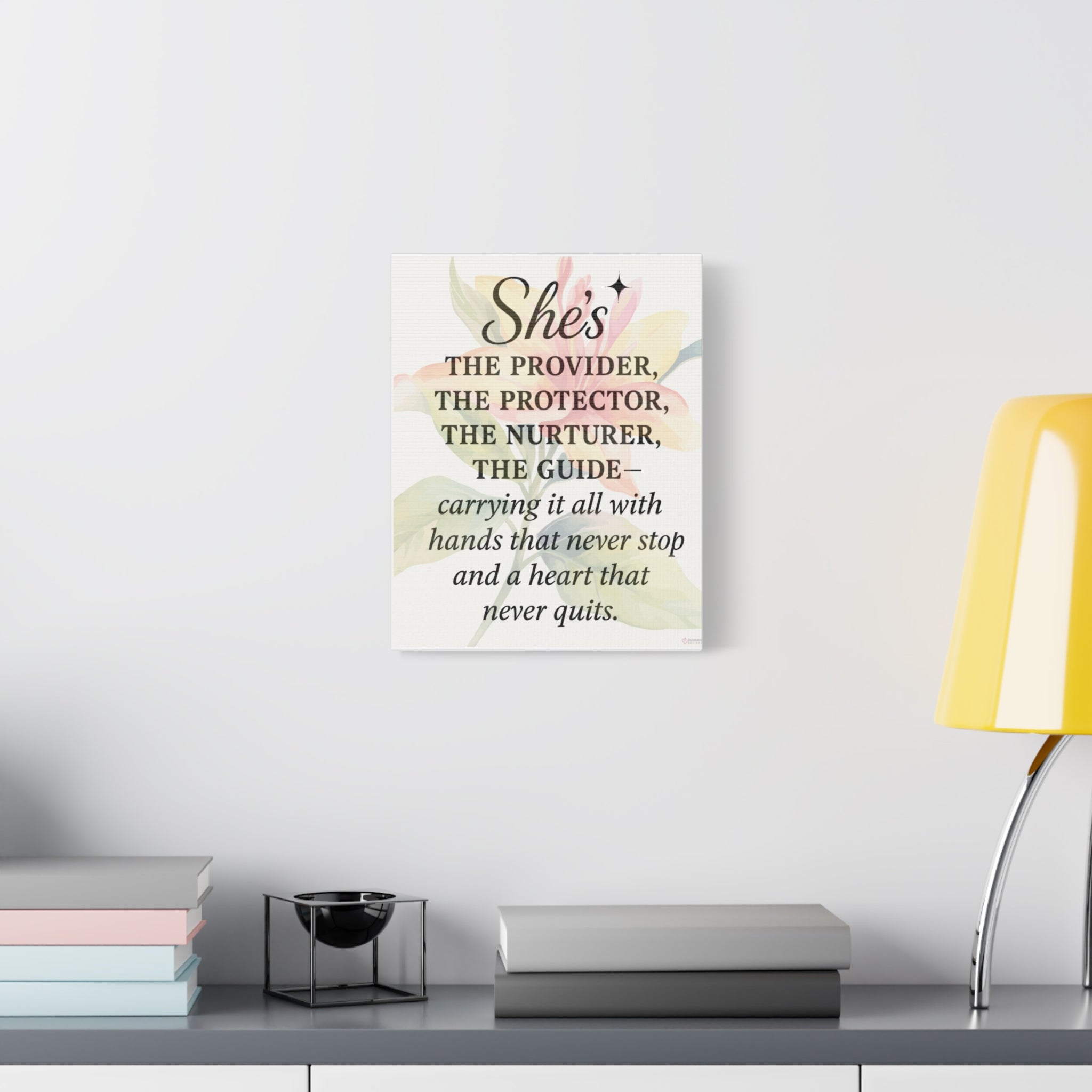 Motivational wall art for mom displayed above a modern console table in a cozy living space with a yellow lamp and books in the foreground.