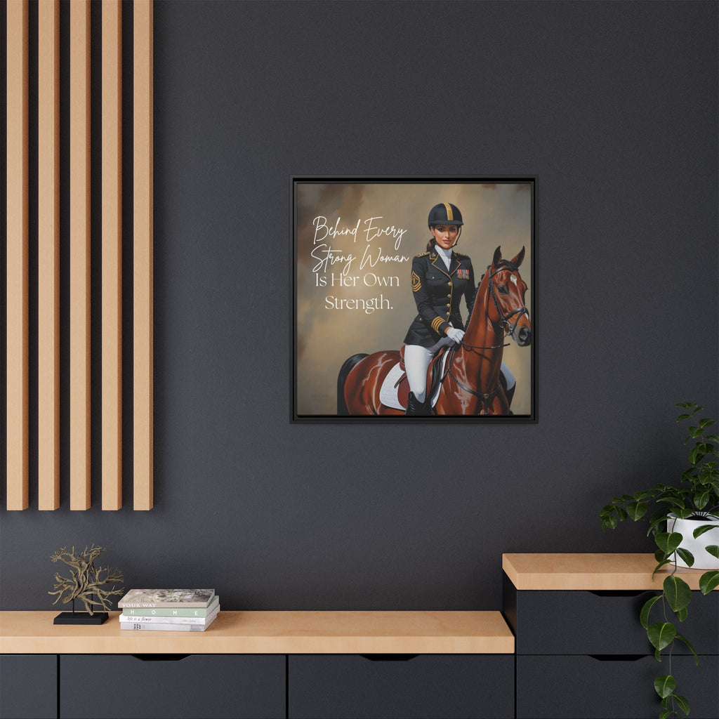 Framed artwork of a woman on horseback with inspirational text on a dark wall.