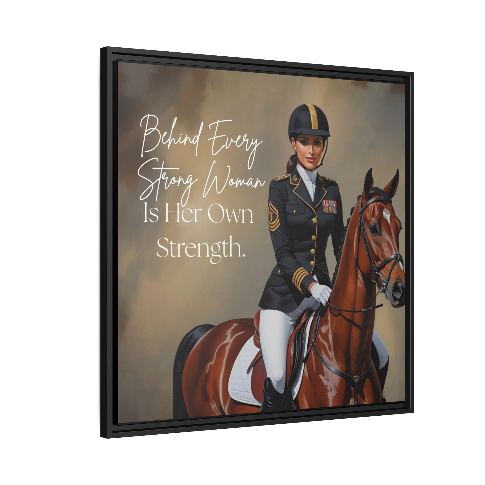 Framed artwork of a woman in equestrian attire on a horse, featuring quote 'Behind Every Strong Woman Is Her Own Strength.'