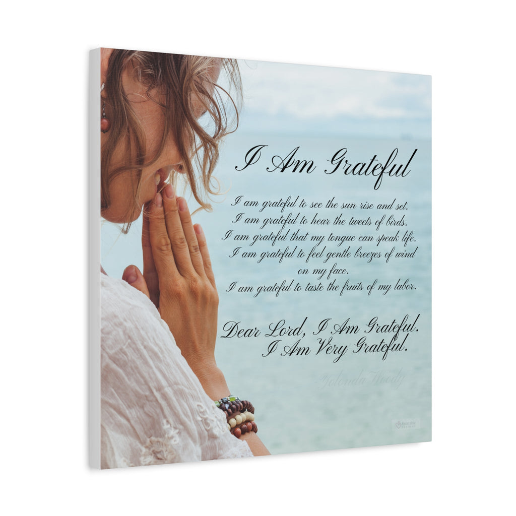 Canvas wall decor with a woman praying and text on a light blue background. Side View. 