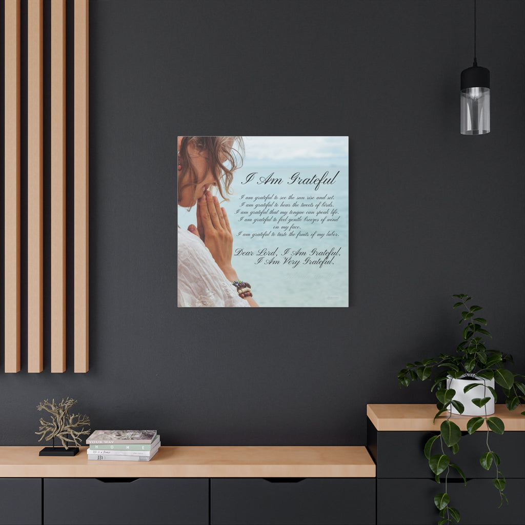 Framed artwork with a woman praying and text on a dark wall above a wooden shelf.