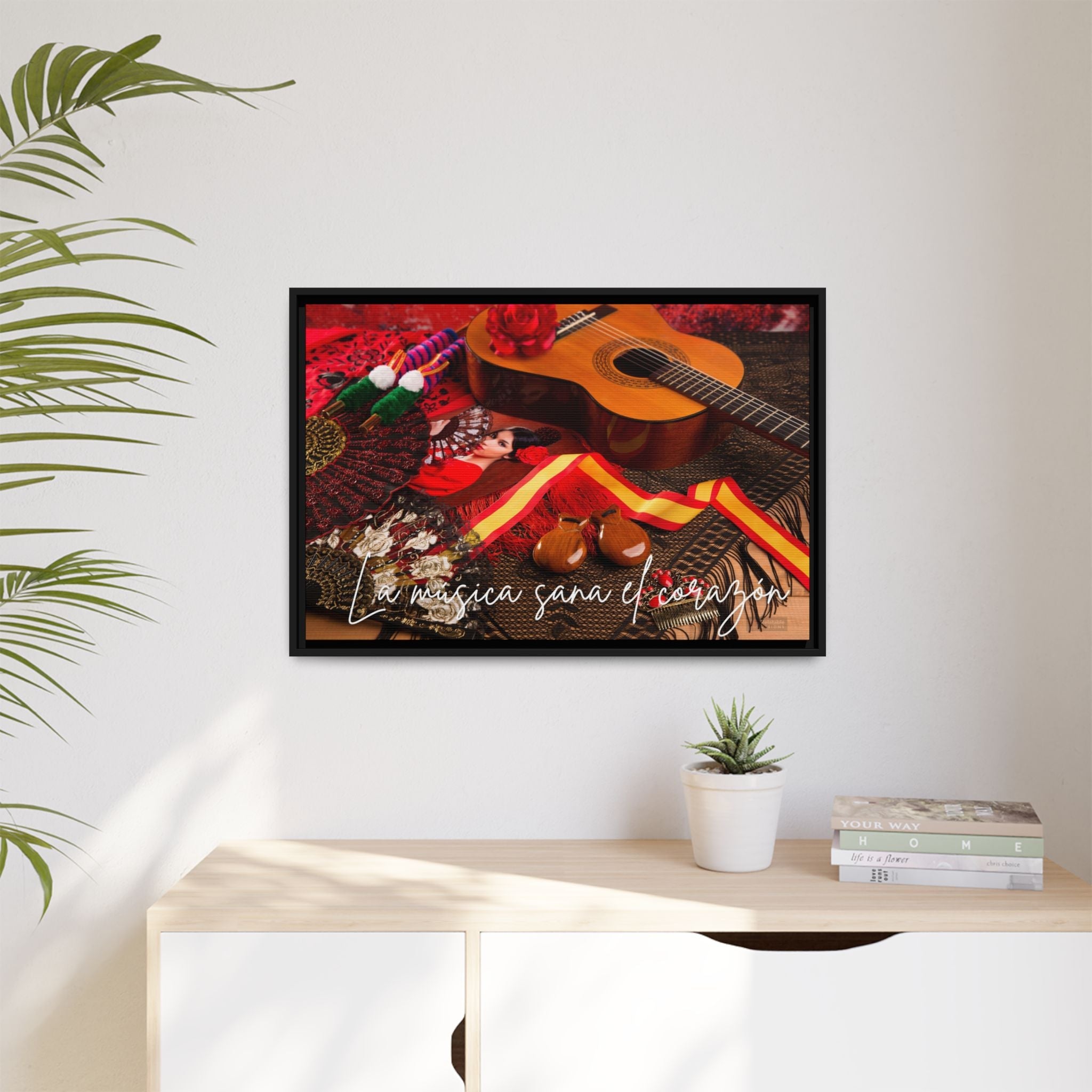 Framed artwork with a guitar and decorative elements on a wall above a desk by Relatable Designs.
