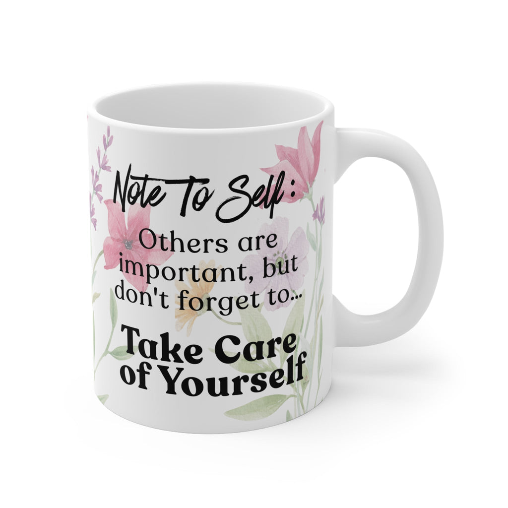 Self care reminder mug with “Take Care of Yourself” quote on ceramic coffee cup with soft floral design