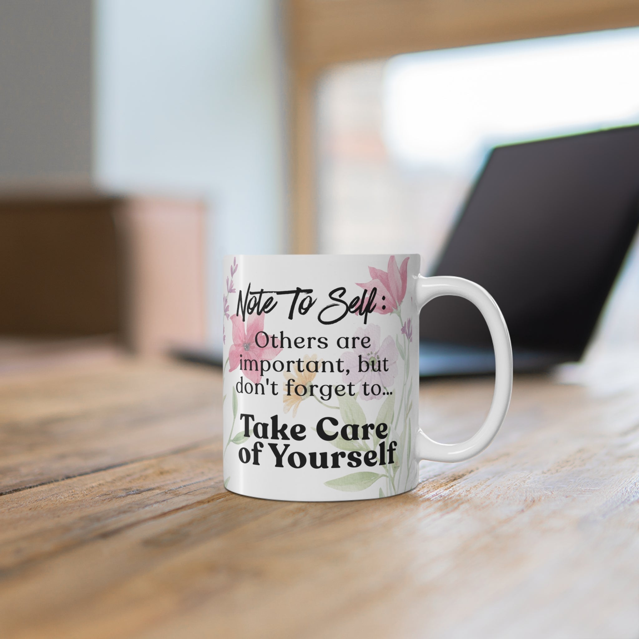 Inspirational self-care mug on a desk with coffee in a calm and cozy workspace setting