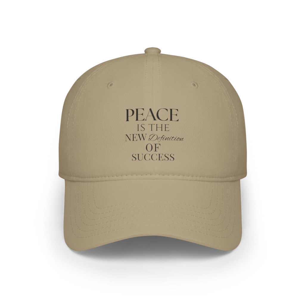 Beige cap with 'Peace is the New Definition of Success' text on a white background