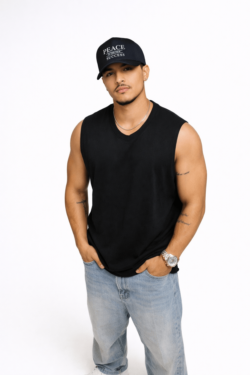 Male model wearing black embroidered Peace statement cap with street wear look