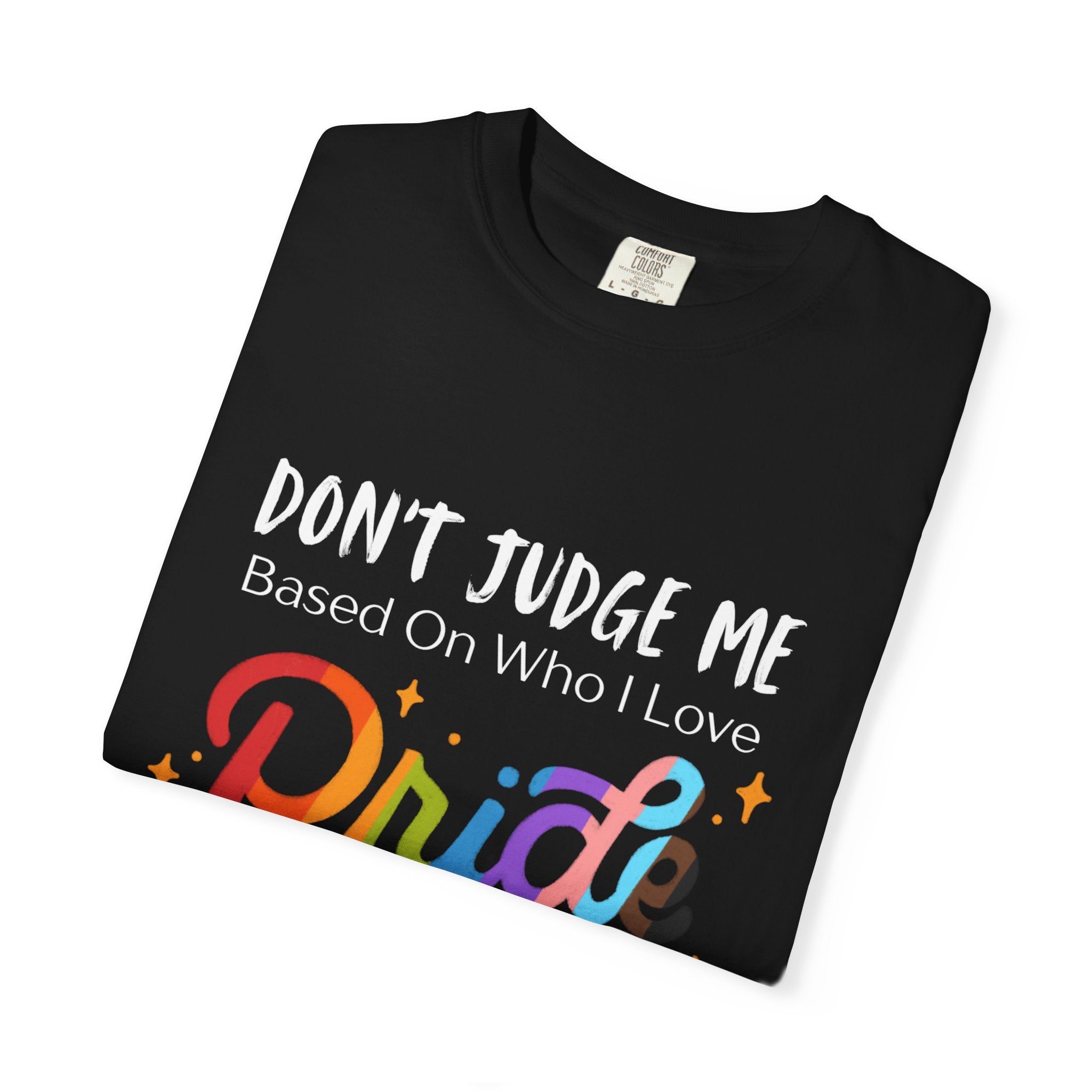 Folded Black t-shirt with rainbow-colored 'Pride' text and slogan on a white background