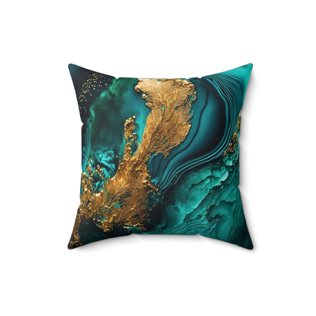 Decorative pillow with green and gold abstract design on a white background