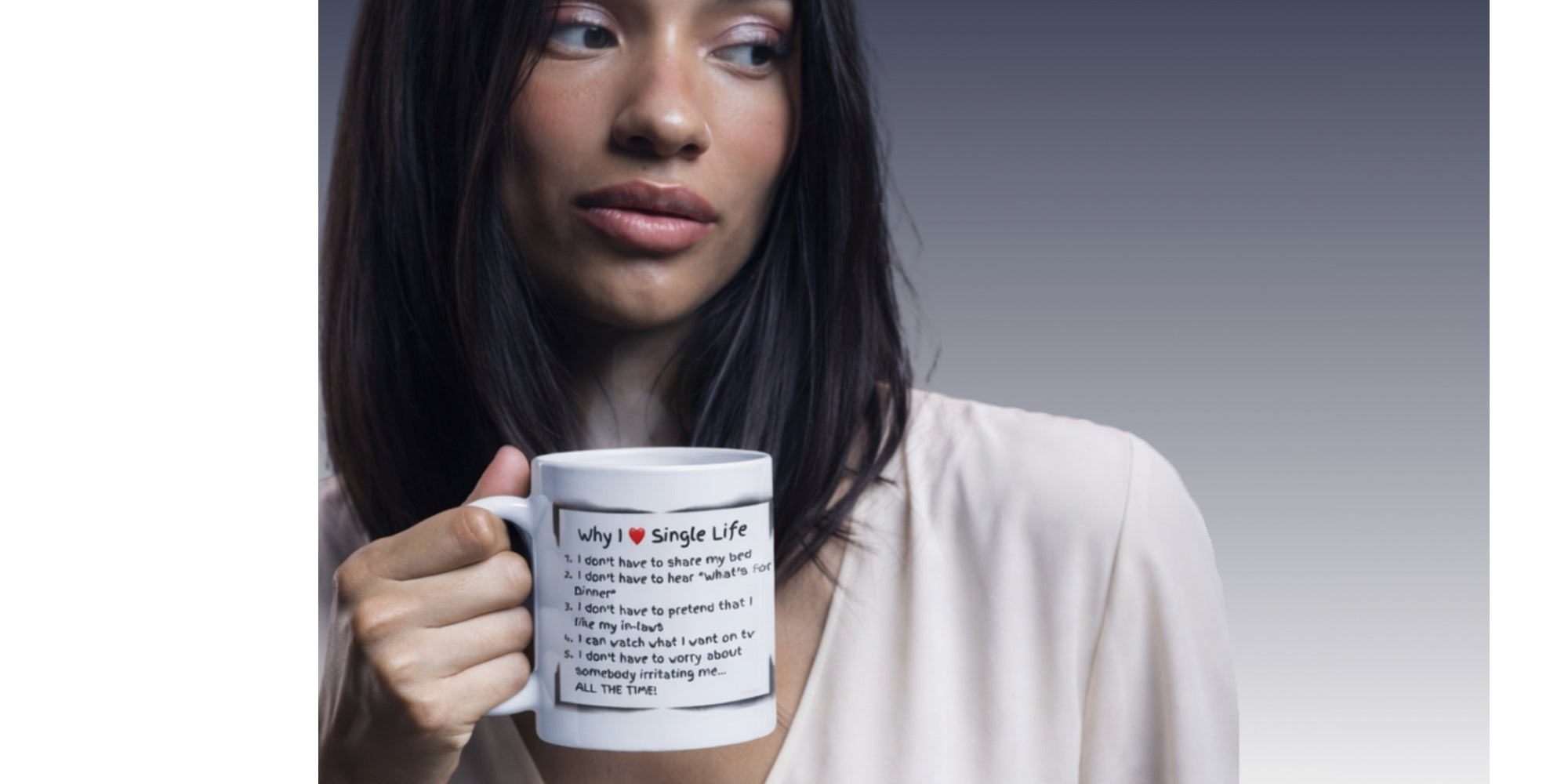 Woman holding a white mug with text  "Why I Love Being Single" quote