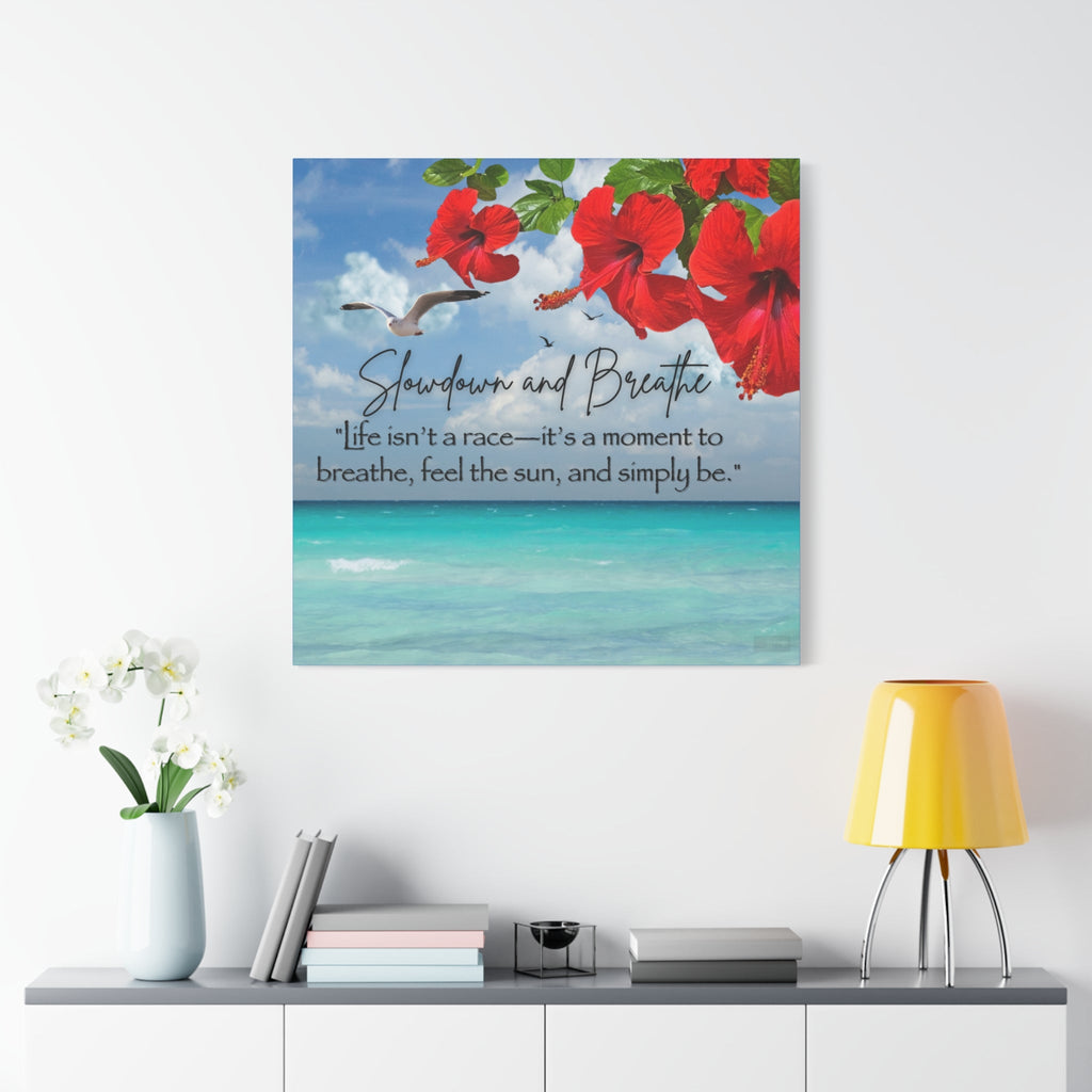 Decorative wall art with red floral design and inspirational quote on a white wall above a shelf.