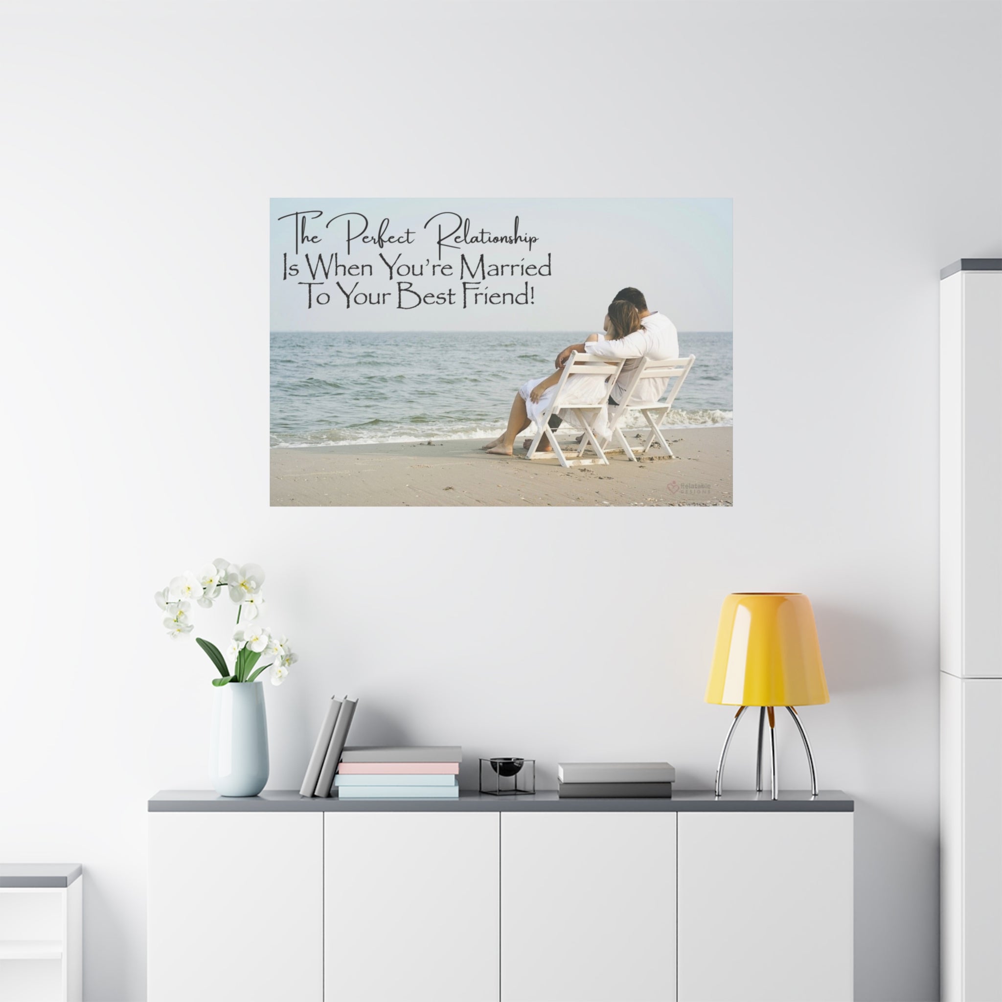 Romantic Wall art of a couple on a beach with a quote 'The Perfect Relationship Is With Your Best Friend' above a white cabinet.