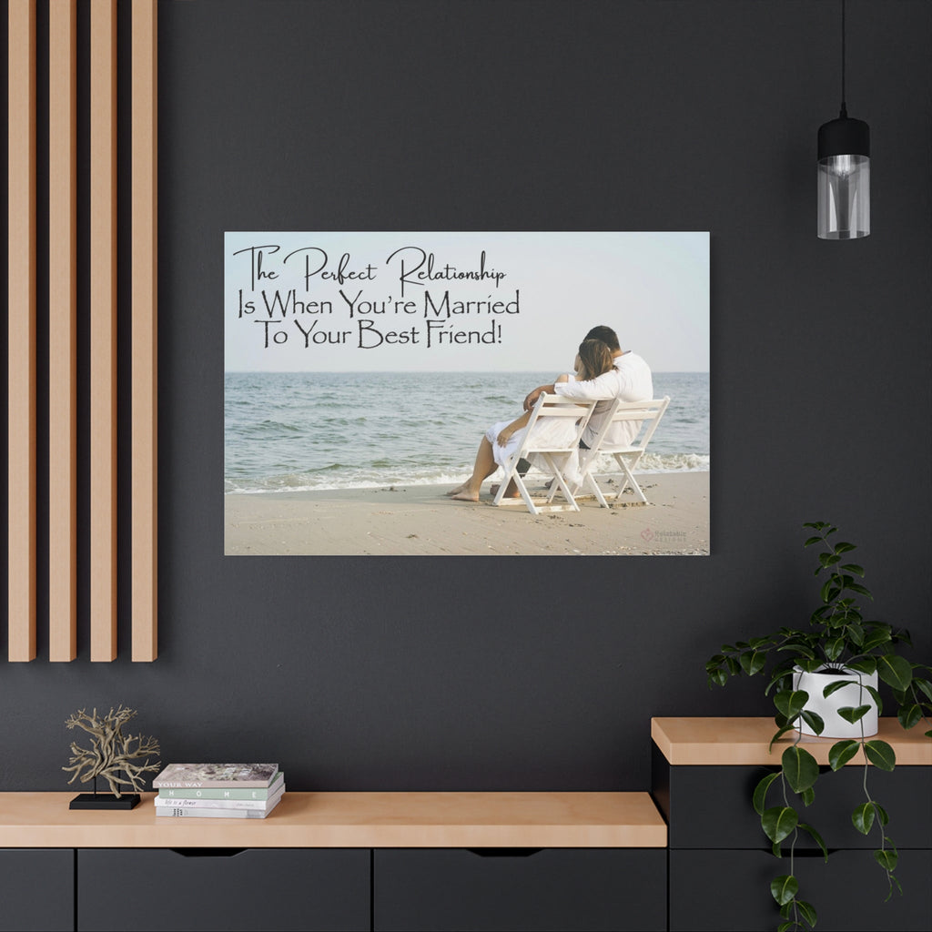 Canvas wall art of a couple on a beach with a quote above them, displayed on a dark wall.