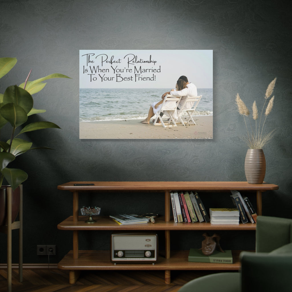 Framed picture of a couple on a beach with a love and relationship quote above a wooden shelf.