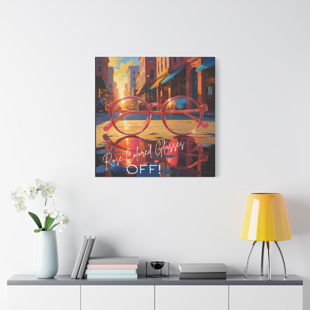 Vibrant canvas print of a city street scene with pink glasses and 'Rose Colored Glasses Off!' text on a white wall above a shelf.