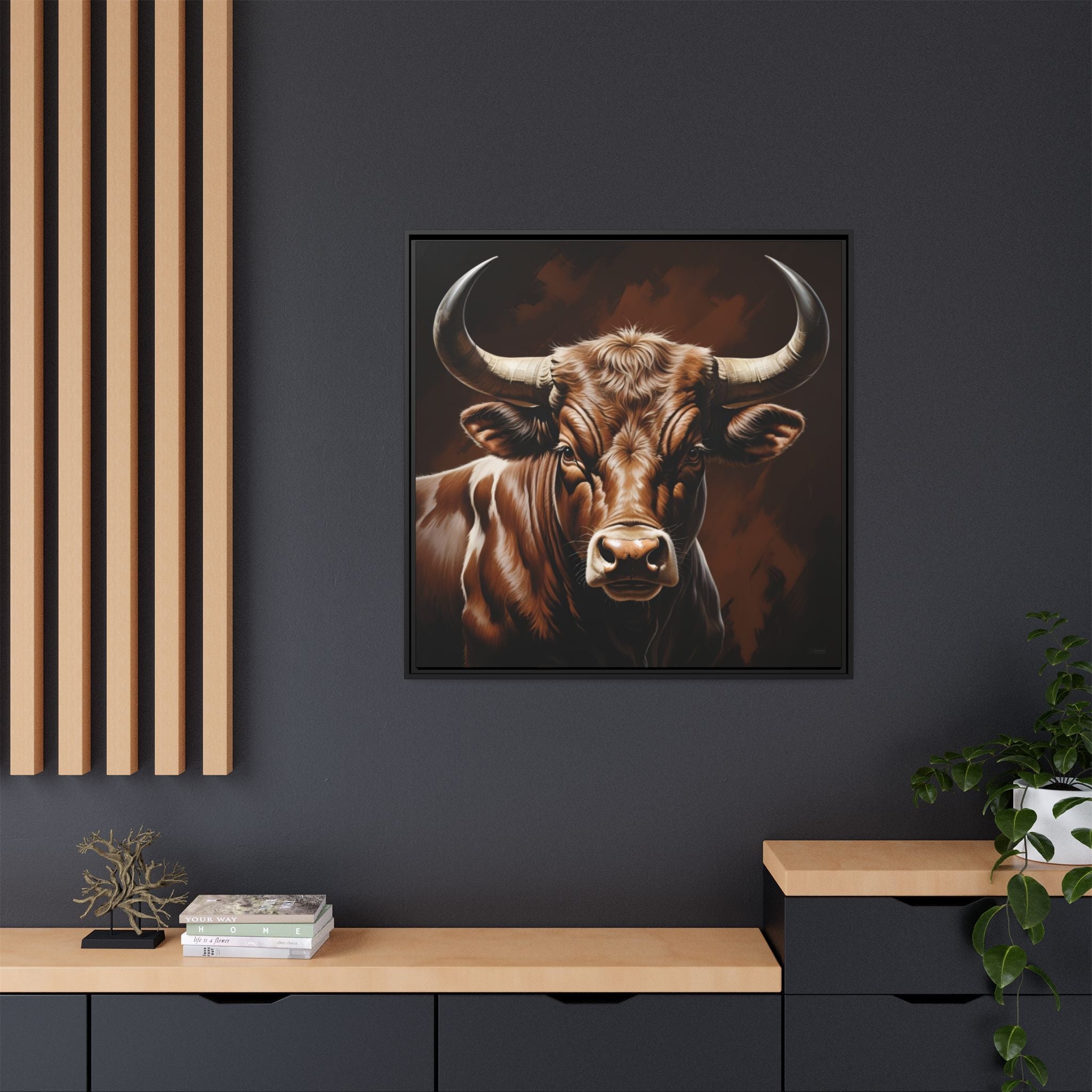 Framed wall decor of a bull on a dark wall with wooden shelves and decor.