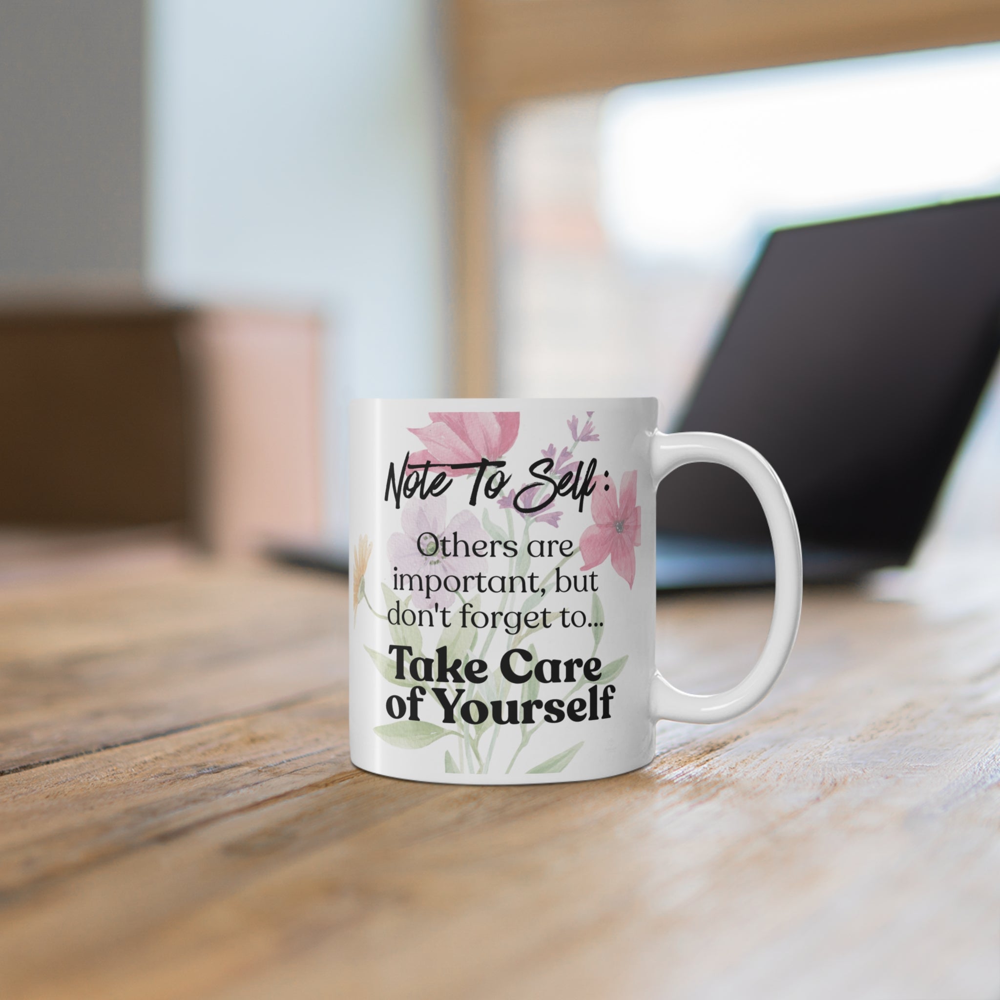 Mug with motivational quote on a wooden desk