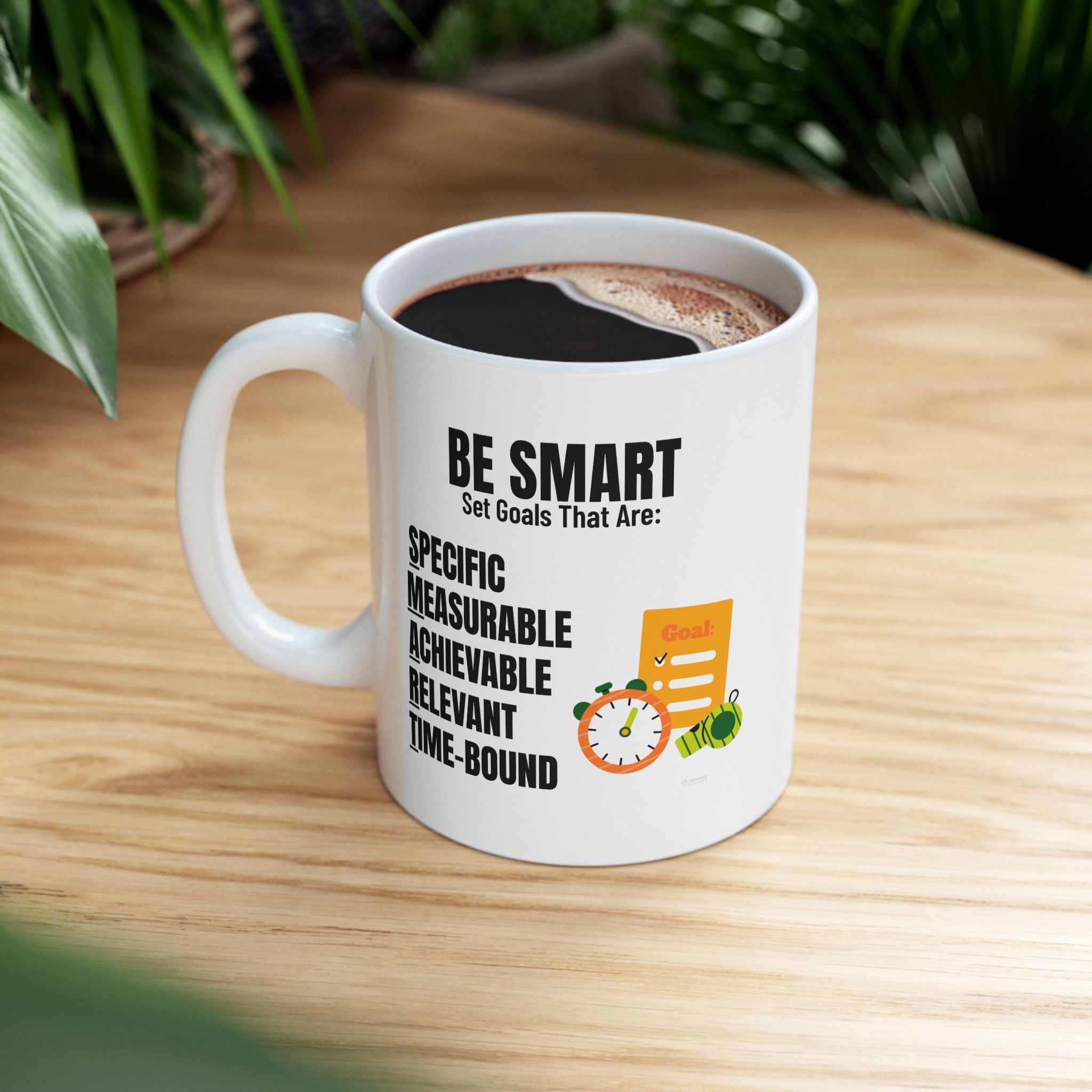 Motivational S.M.A.R.T. Goals white ceramic mug with motivational quote on a wooden table