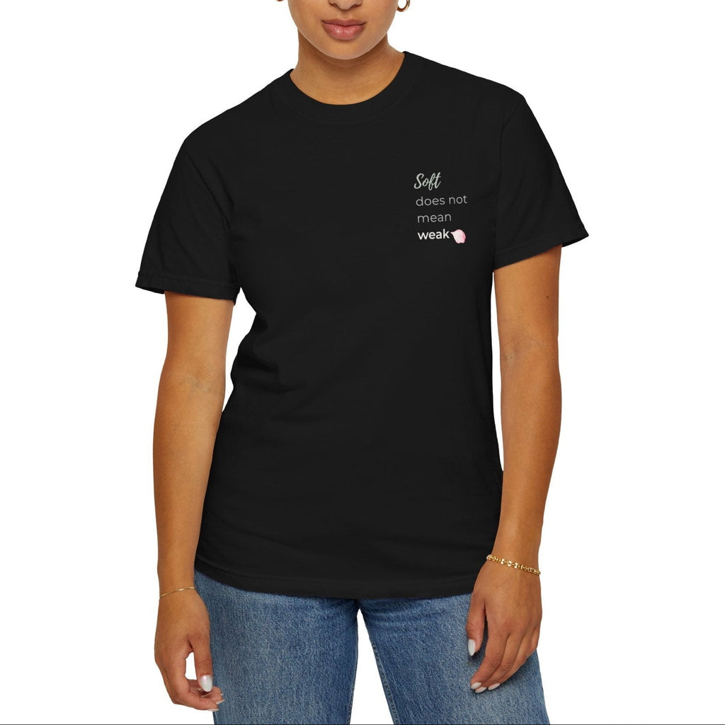 Woman wearing a black t-shirt with text Soft does not mean weak on a white background 