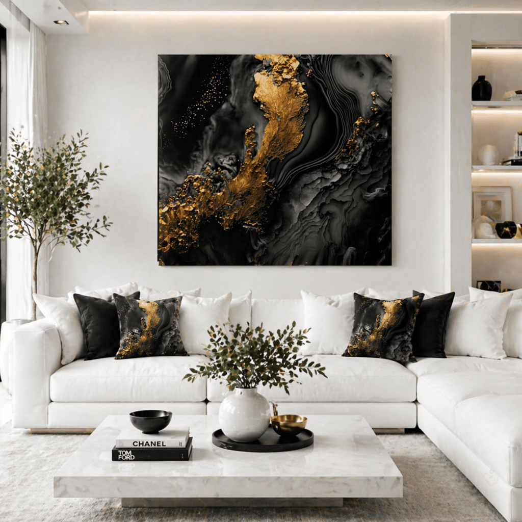 Modern living room with white sofa, abstract art, and decorative black and gold abstract pillows