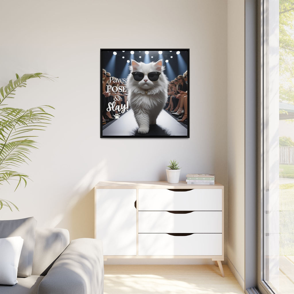 Framed picture of a fashion cat wearing sunglasses on a wall in a modern living room.