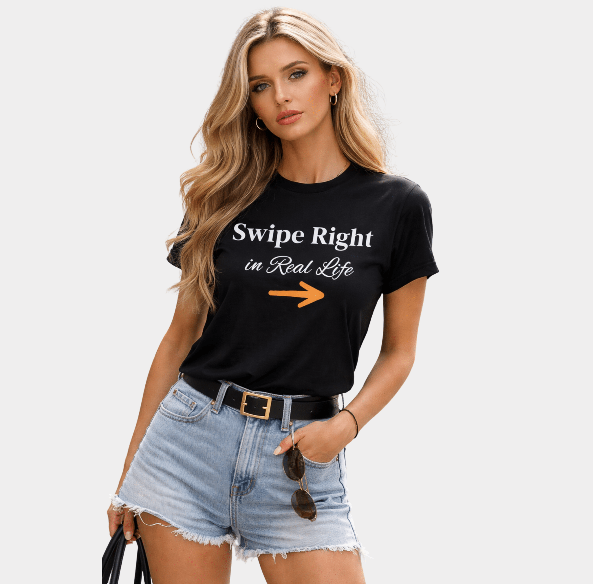 Woman wearing black "Swipe Right in Real Life" graphic t-shirt styled with denim shorts–funny dating conversation starter tee