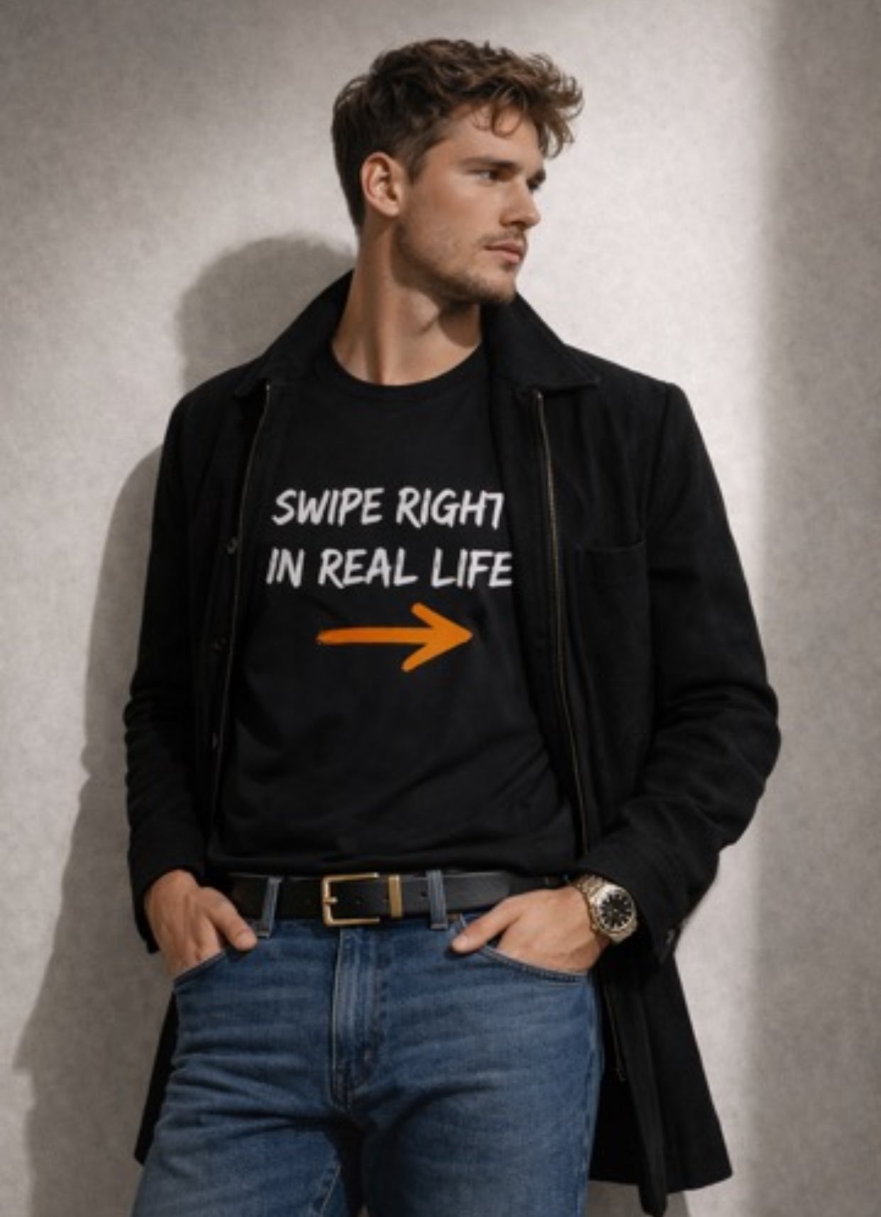 Man wearing a Relatable Designs black t-shirt with 'Swipe Right in Real Life' text and an arrow graphic, standing against a plain background.