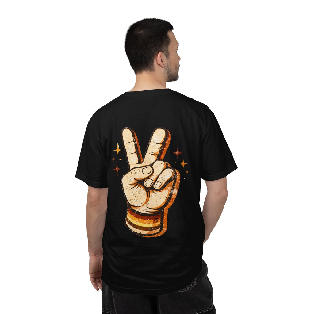 Man wearing a black t-shirt with a peace sign design on the back, standing against a white background.