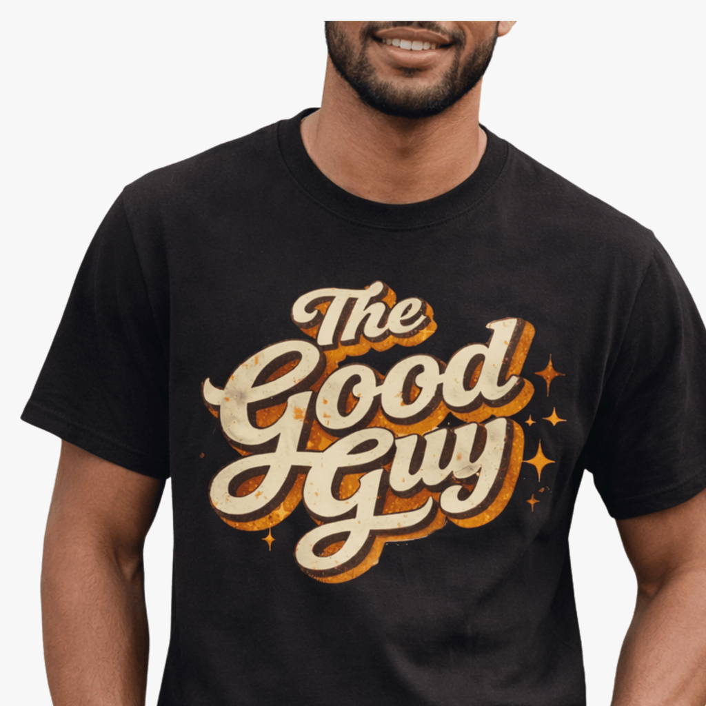 Person wearing a black t-shirt with 'The Good Guy' text design by Relatable Designs