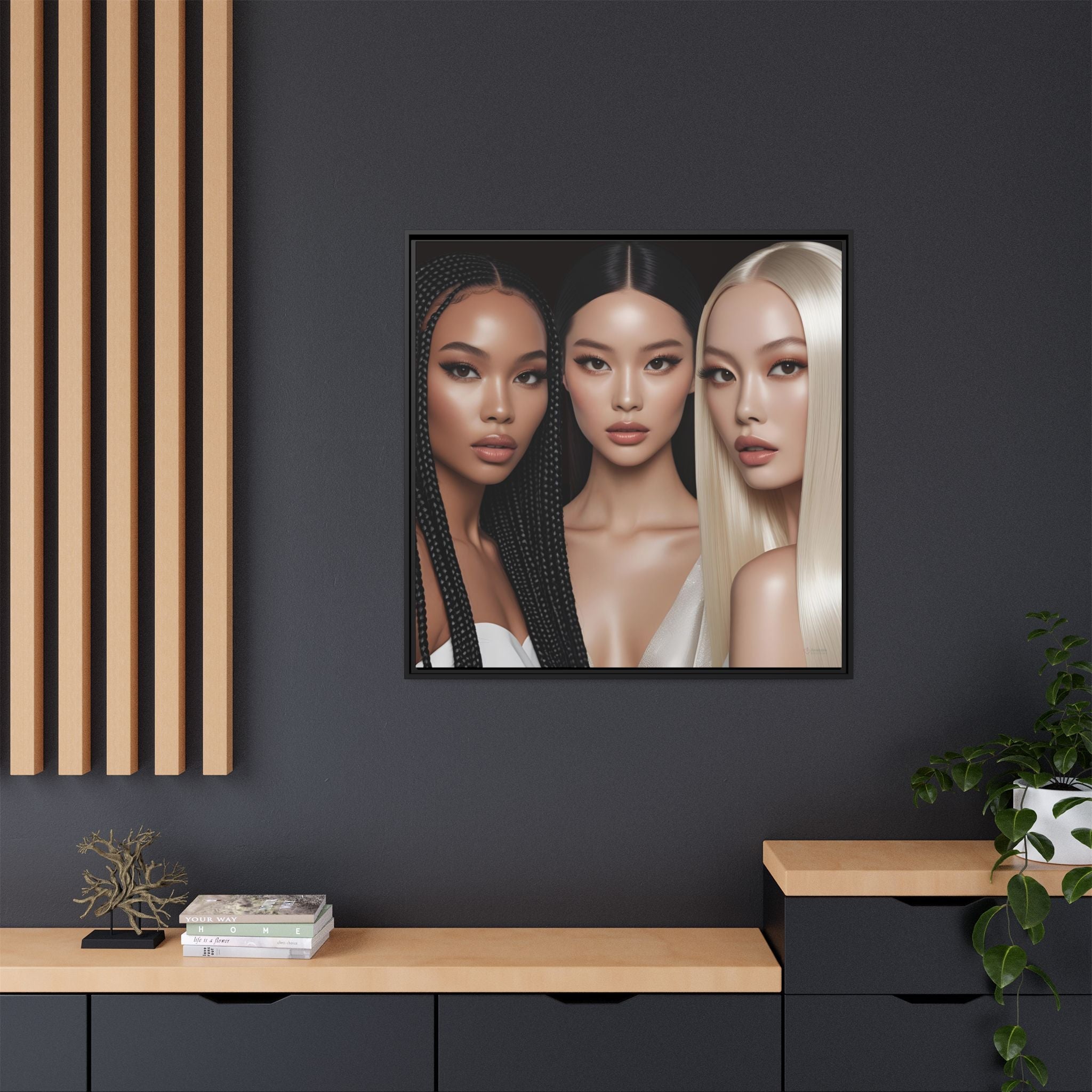 Framed canvas artwork of three women with different hair colors on a dark wall.