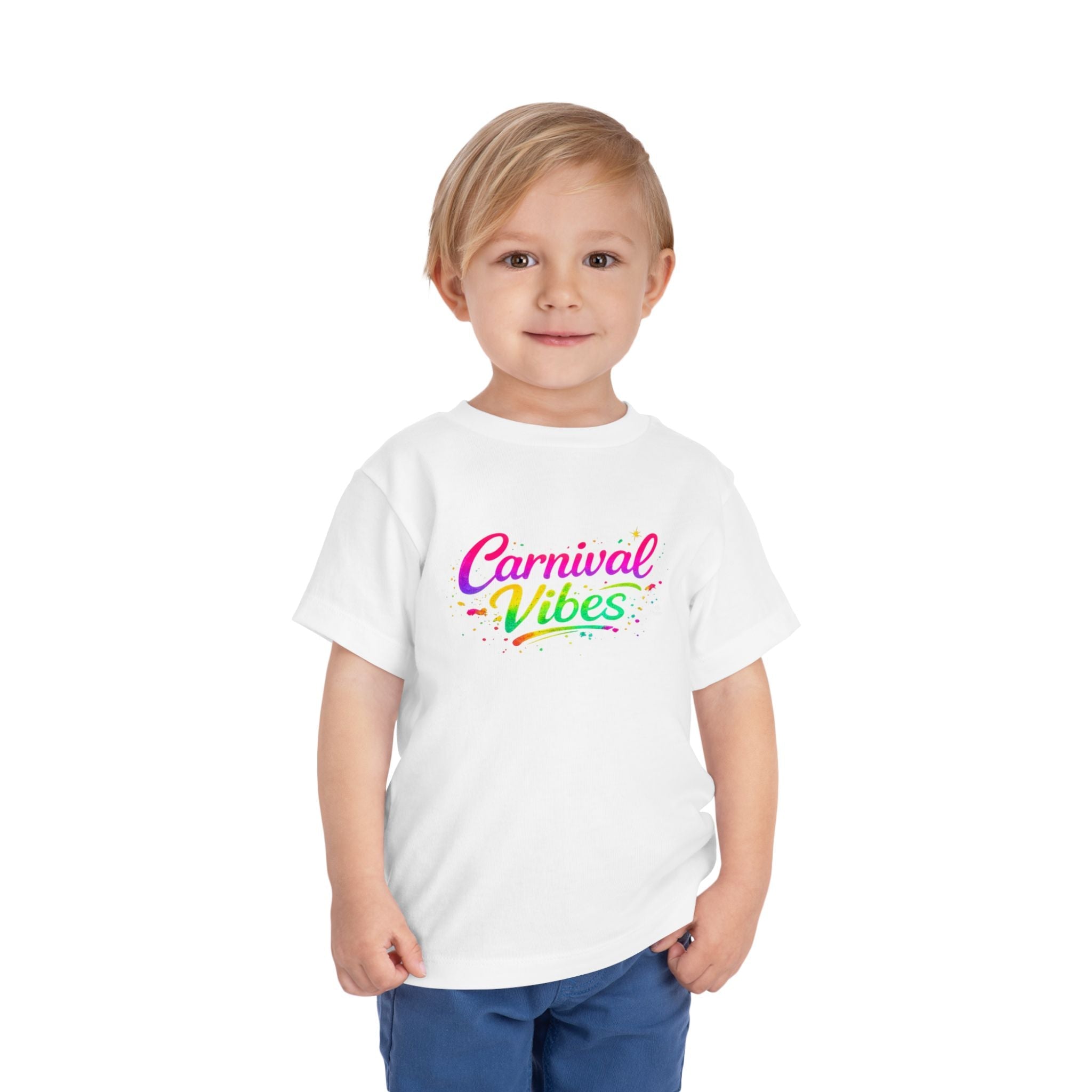 Toddler wearing graphic white t-shirt with colorful text 'carnival vibes'. 