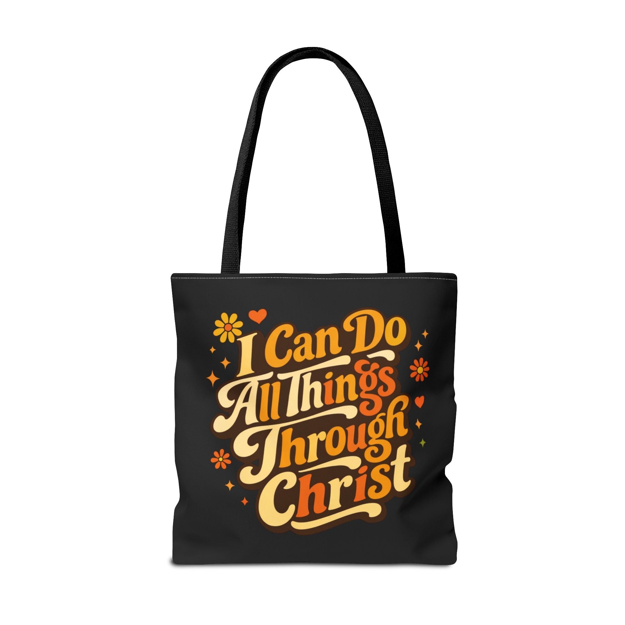 Black tote bag with inspirational quote 'I Can Do All Things Through Christ' in yellow and white on a white background