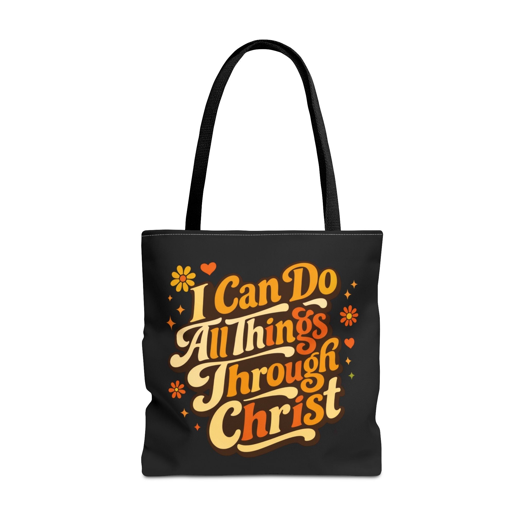 Black tote bag with motivational quote in vintage yellow and orange text 'I can do all things through Christ' on a white background