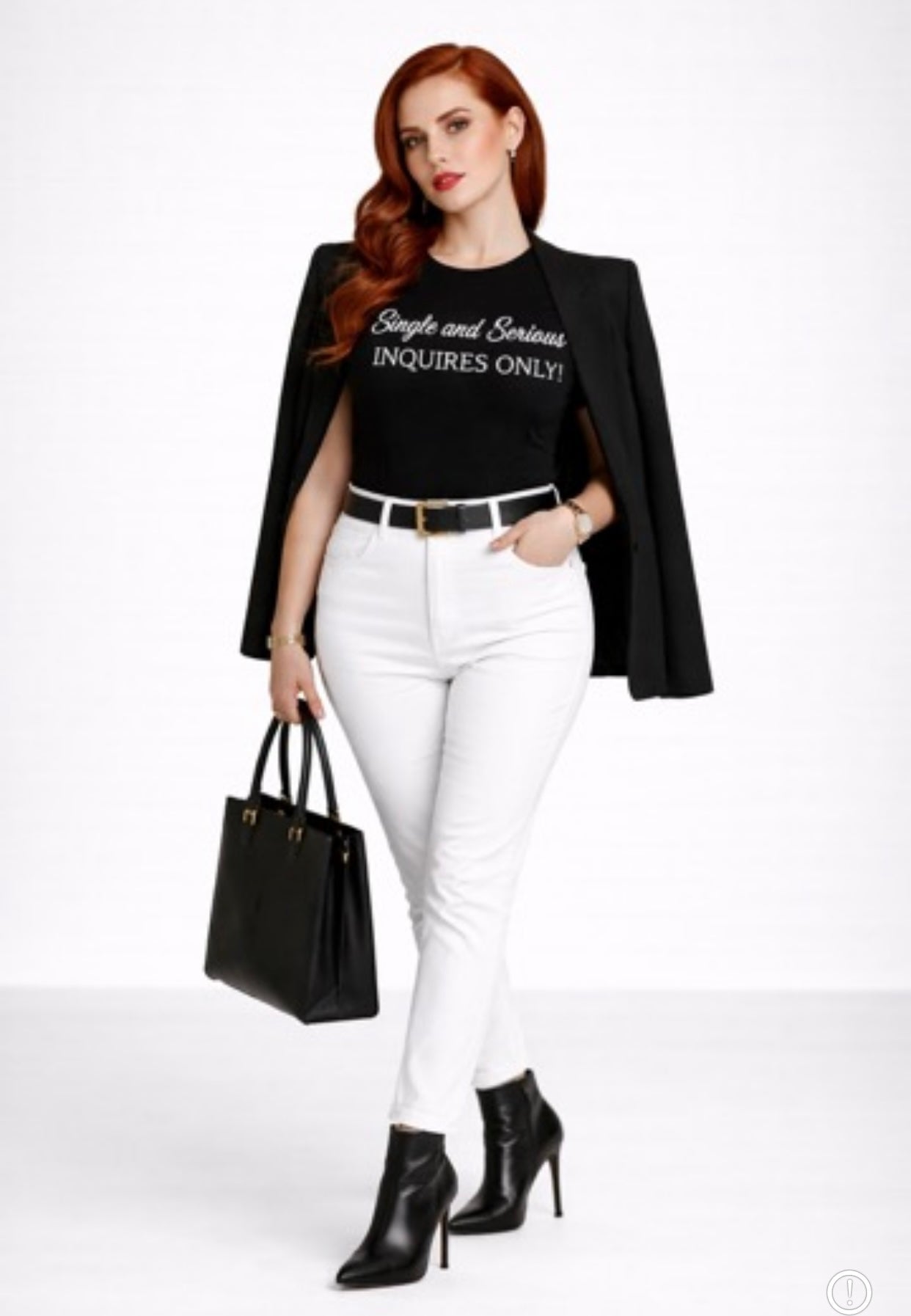 Woman wearing a black blazer, Relatable Designs black graphic tee with white text, white pants, and black boots holding a black handbag on a white background
