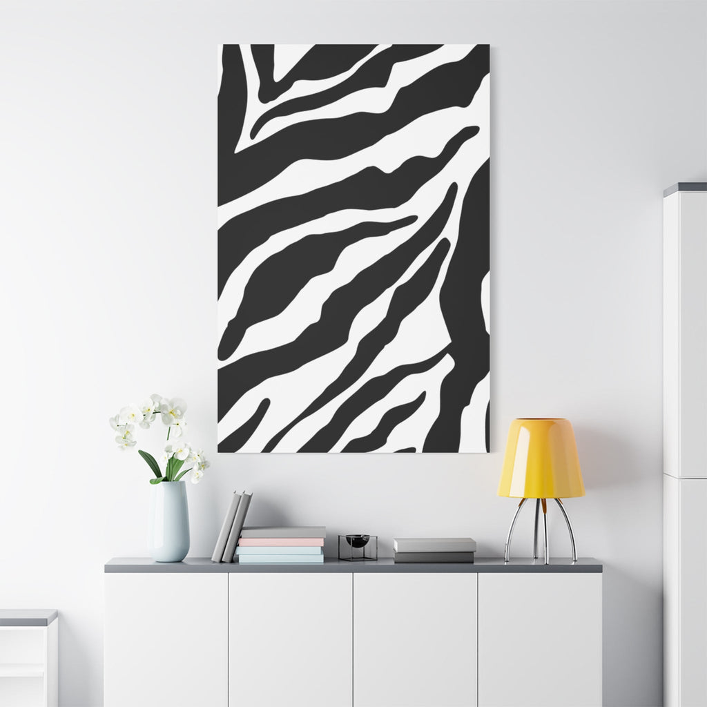Tiger print wall art on a white wall above a white cabinet with decor items.